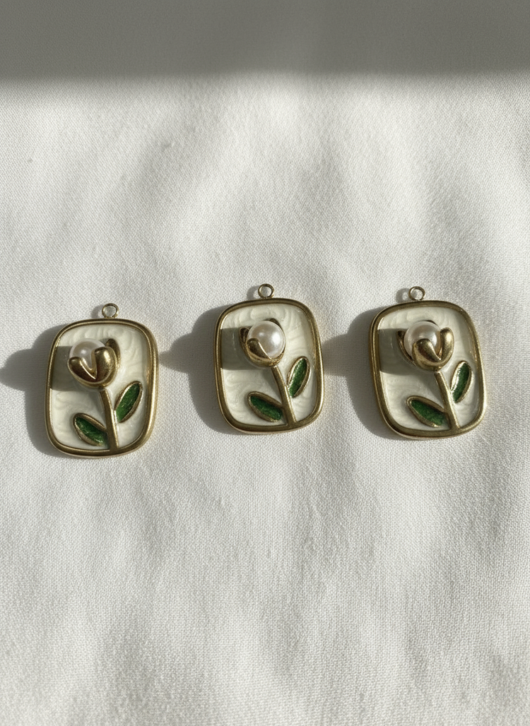 White Enamel Flower With Gold Trim Charm